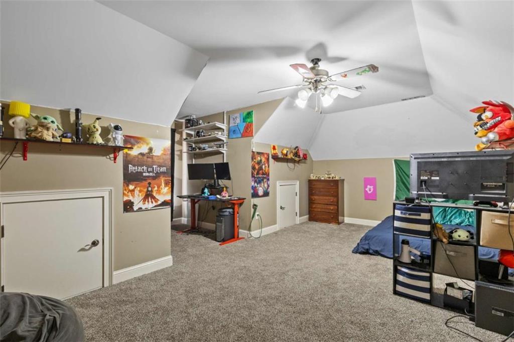 8399 East Carroll Road Whitesburg, GA 30185 - Photo 22 of 52 a living room with furniture and a flat screen tv