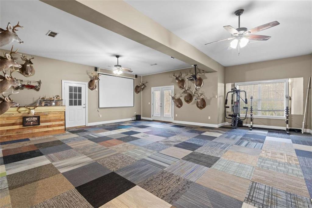 8399 East Carroll Road Whitesburg, GA 30185 - Photo 23 of 52 a view of a livingroom with a ceiling fan and window