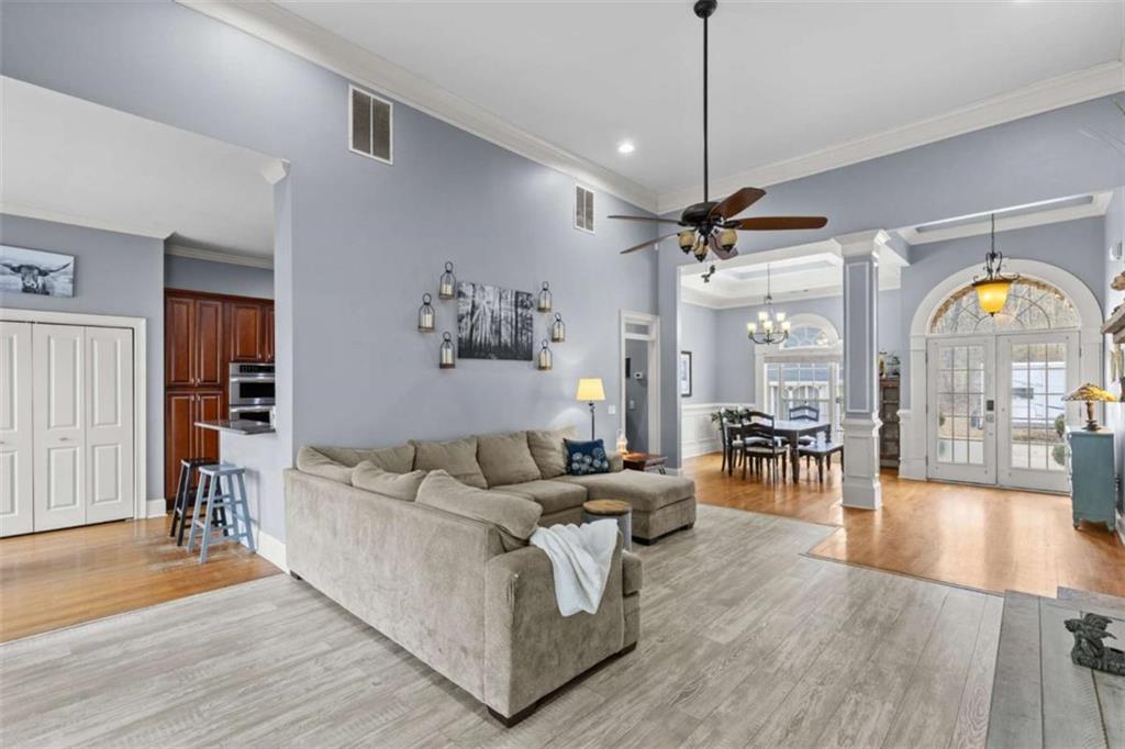 8399 East Carroll Road Whitesburg, GA 30185 - Photo 7 of 52 a living room with furniture fireplace and wooden floor