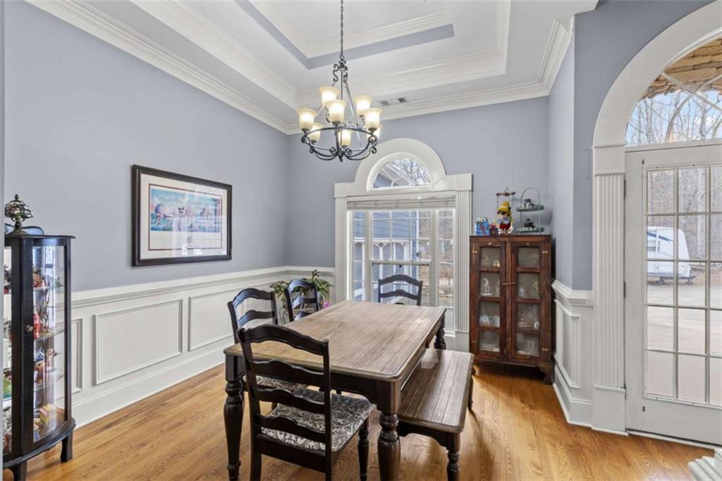 8399 East Carroll Road Whitesburg, GA 30185 - Photo 8 of 52 a view of a dining room with furniture window and wooden floor