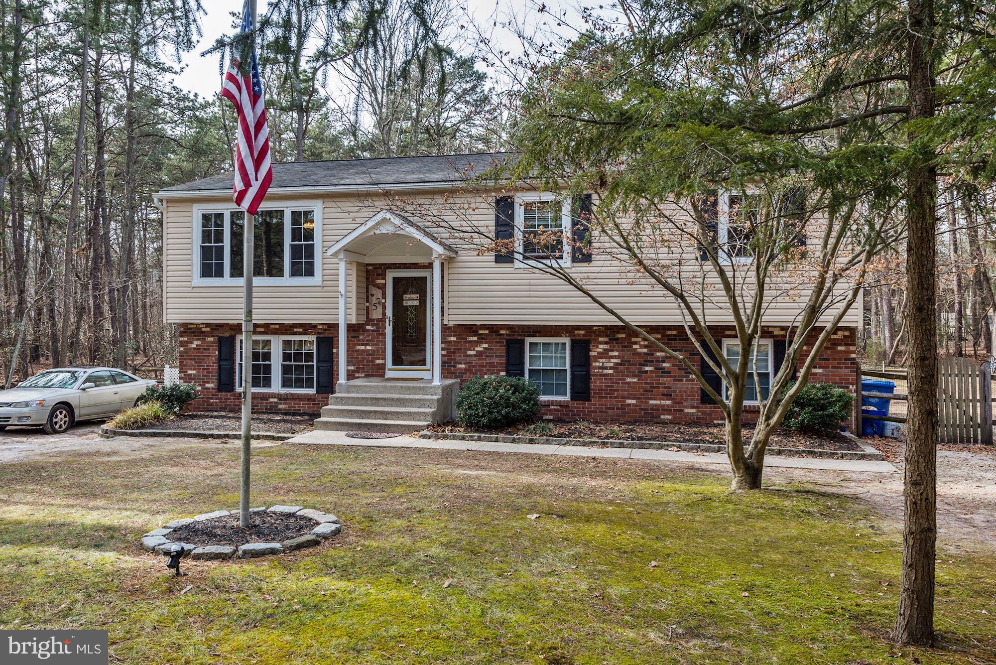 5 Spring Drive Tabernacle, NJ 08088 - Photo 2 of 29 a front view of a house with a yard