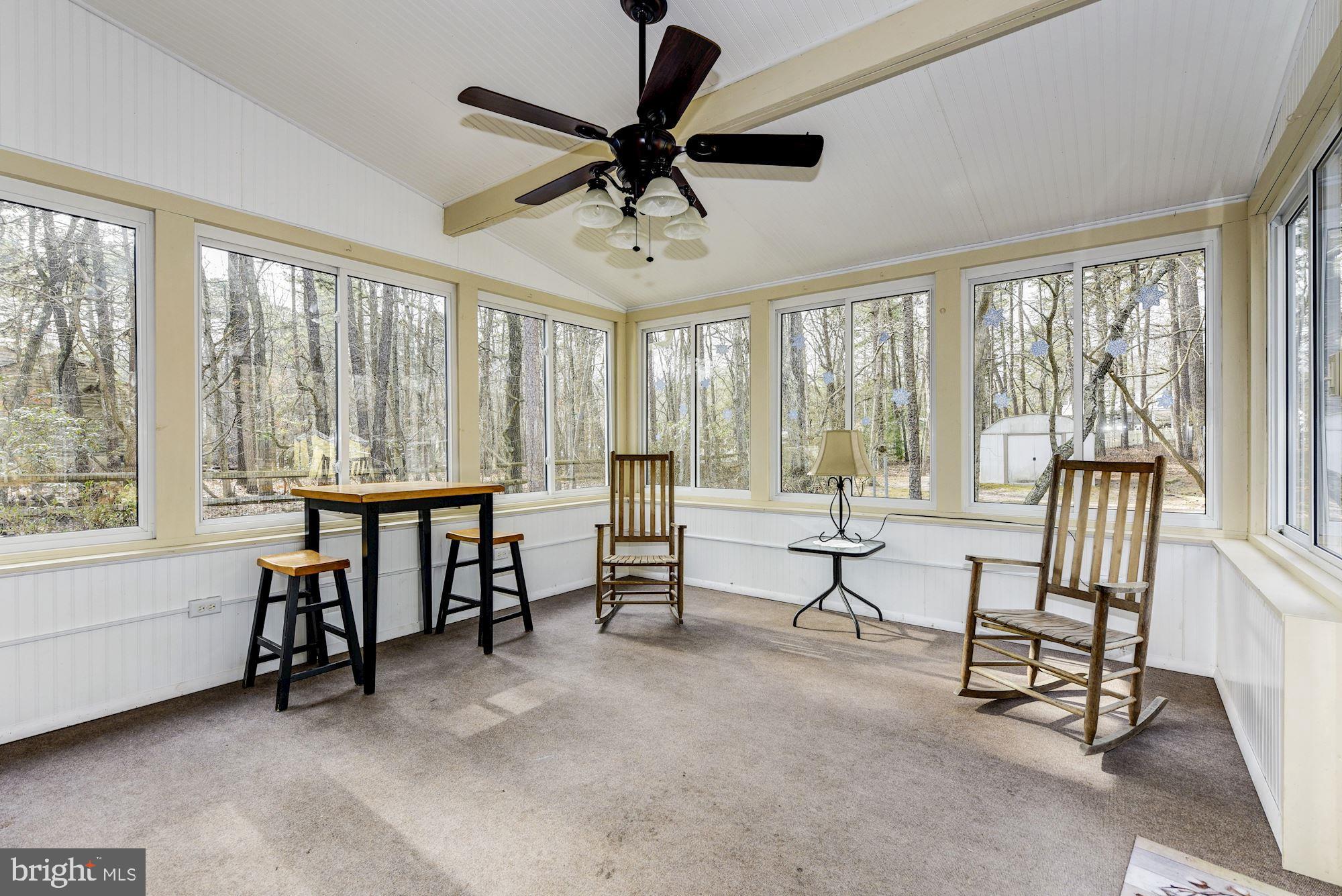 5 Spring Drive Tabernacle, NJ 08088 - Photo 20 of 29 a living room with furniture and a floor to ceiling window