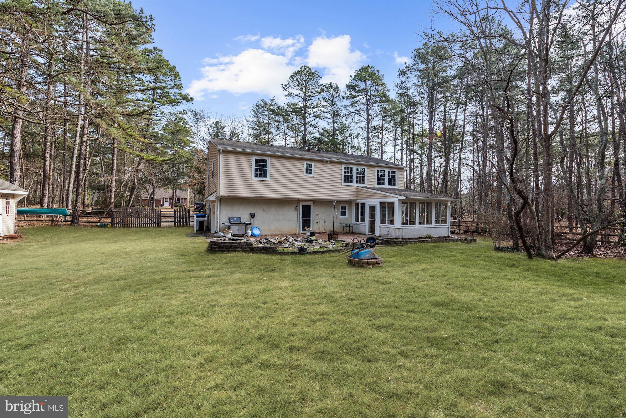 5 Spring Drive Tabernacle, NJ 08088 - Photo 23 of 29 a view of a house with backyard and sitting area
