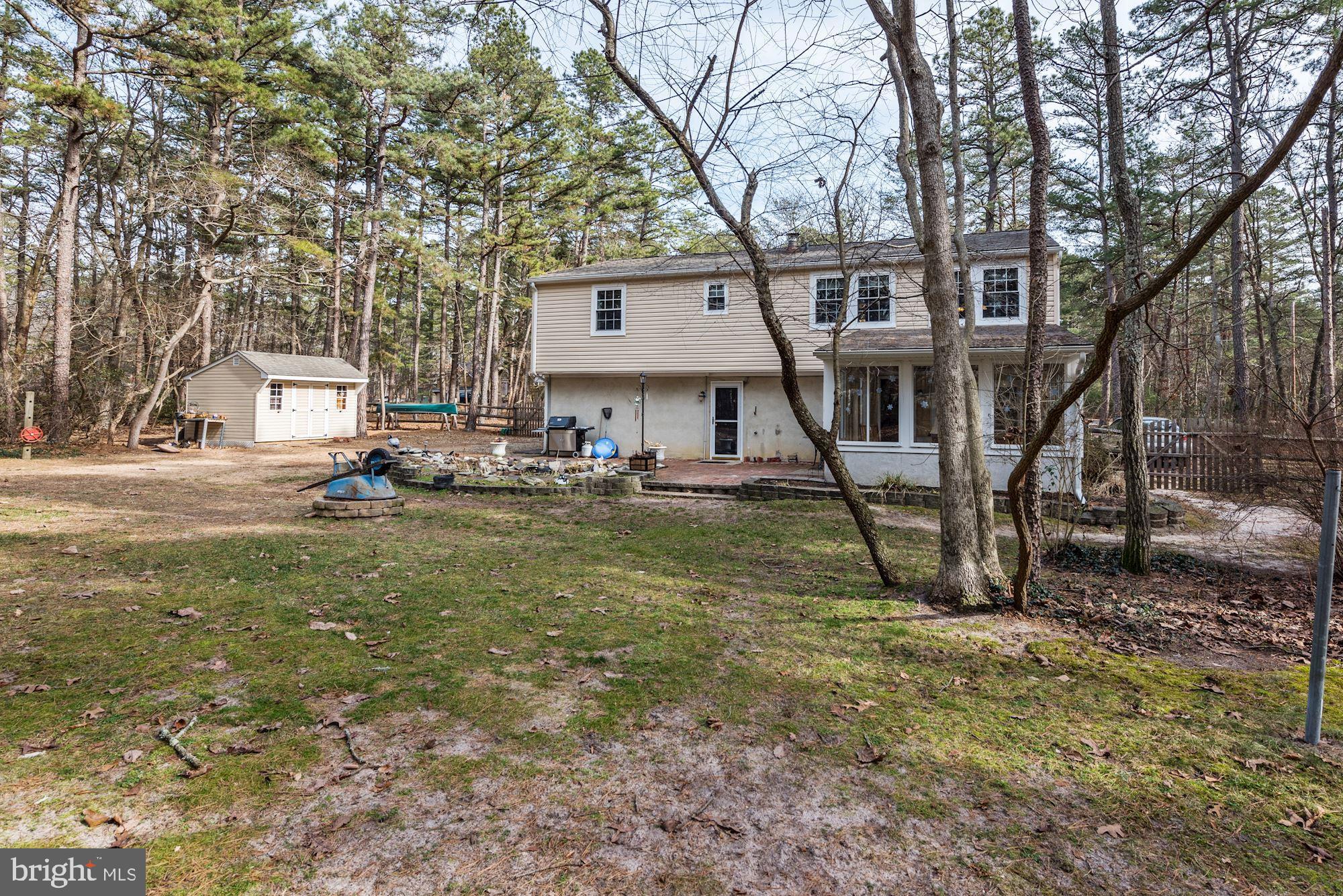 5 Spring Drive Tabernacle, NJ 08088 - Photo 27 of 29 a view of a house with a yard and sitting area