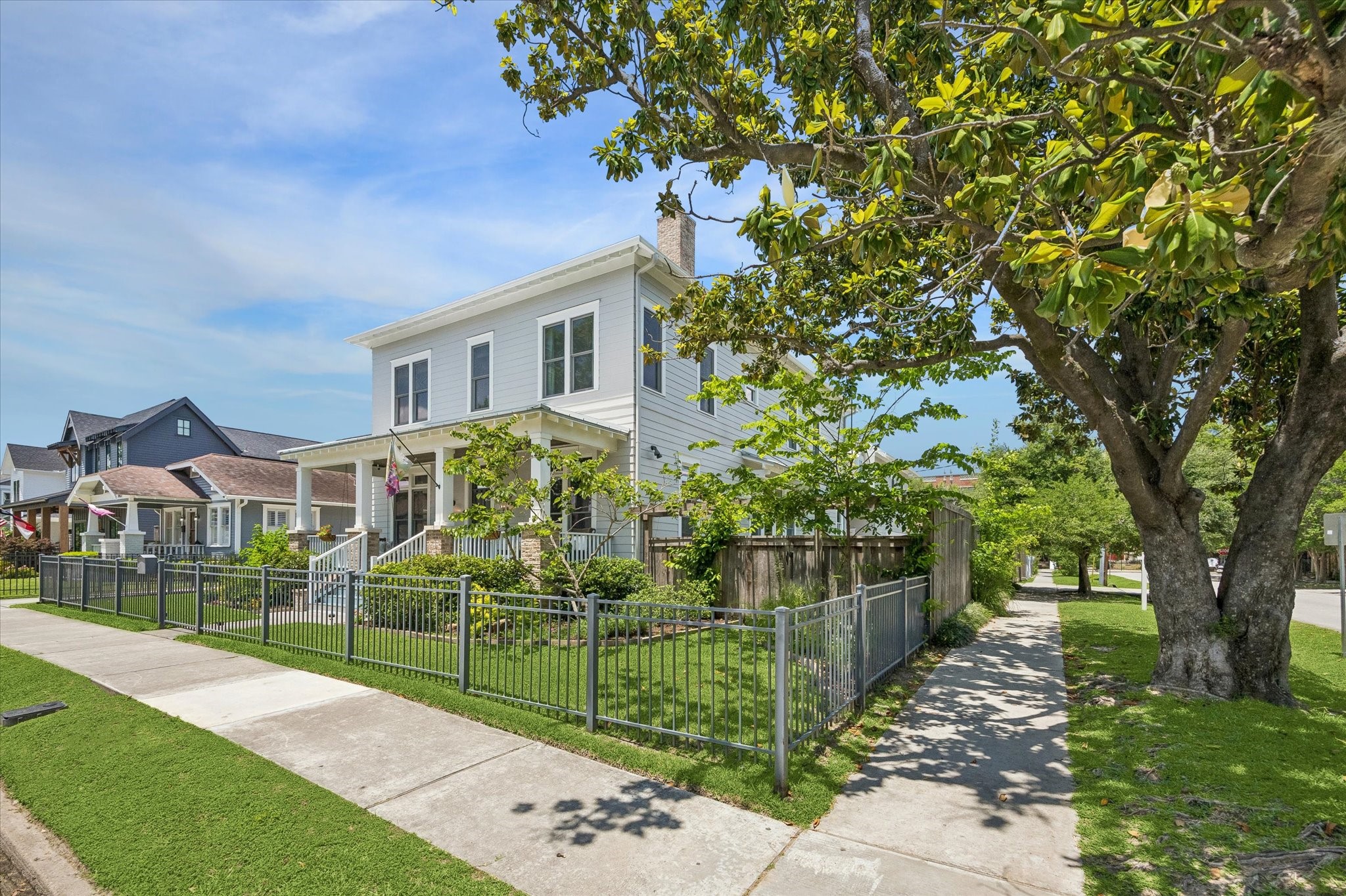 1101 Omar Street Houston, TX 77009 - Photo 5 of 46 Positioned on a coveted corner lot surrounded by mature trees and one of the Heights’ most beloved neighborhood settings.
