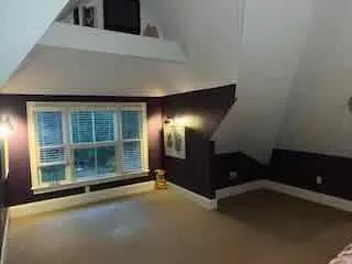 a view of empty room with windows