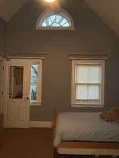 a bathroom with a toilet a sink and a mirror