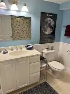a bathroom with a shower curtain
