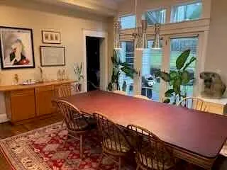 a dining room with a table and chairs