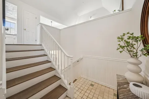 a view of entryway with wooden floor