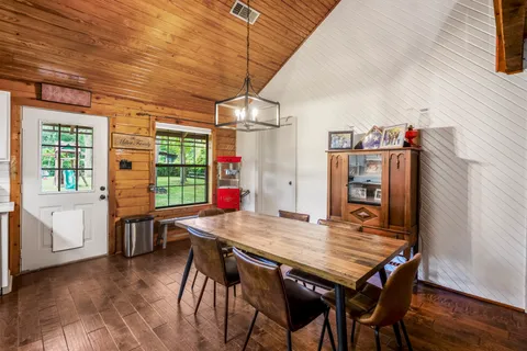 a view of a dining table and chairs in the room