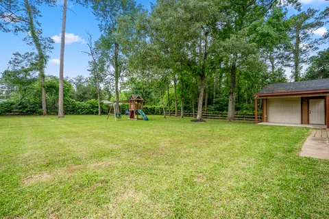 a view of a house with a big yard