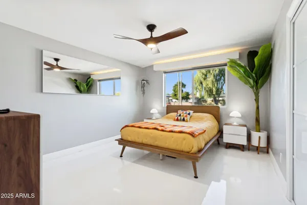 a bathroom with a sink a mirror and vanity