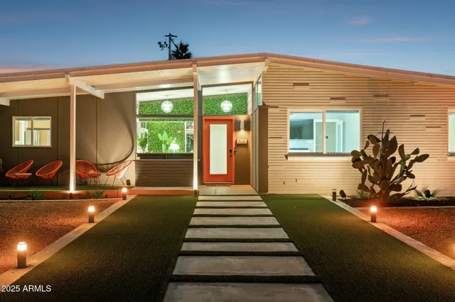 a view of a patio with a table and chairs
