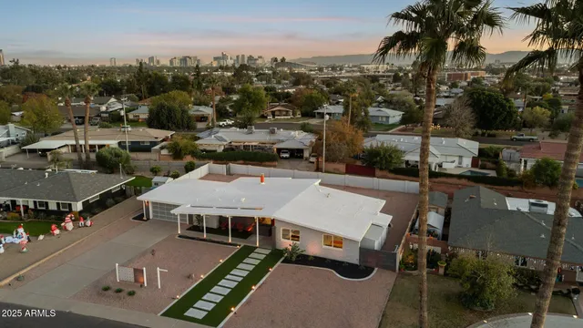 a living room with fireplace and a chandelier