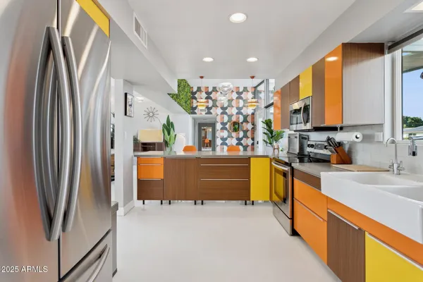 a view of living room filled with furniture and a window