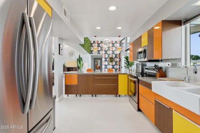 a view of living room filled with furniture and a window
