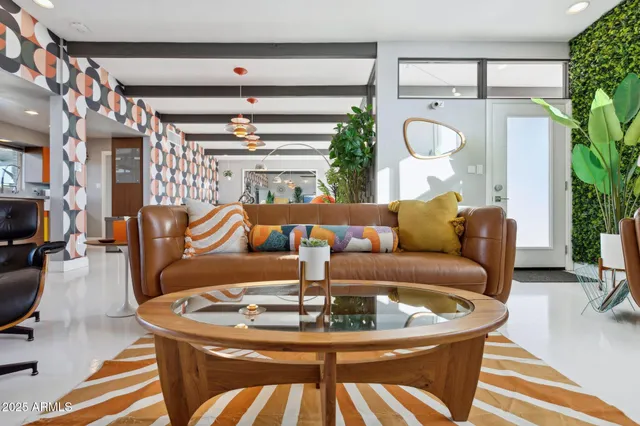 a view of a swimming pool with a patio and plants