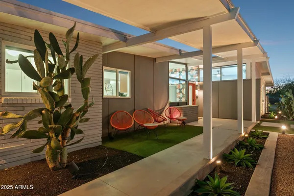 a view of a house with backyard and porch