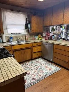 a room with lots of appliances and cabinets