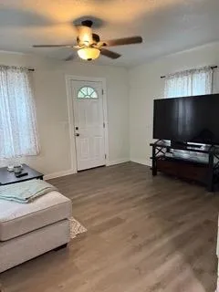 a view of a dining room with furniture and chandelier
