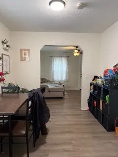 a backyard of a house with table and chairs