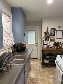 a backyard of a house with barbeque oven