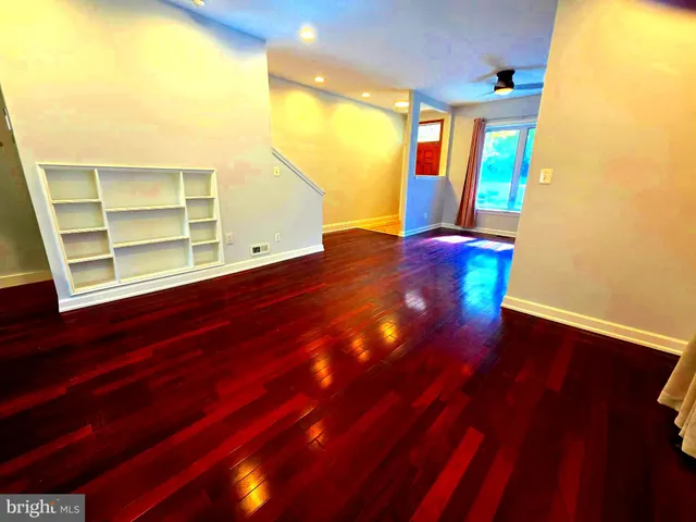 a view of an entryway with wooden floor