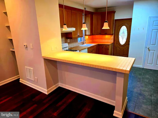 a view of front door with wooden floor