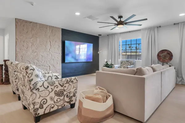 a living room with furniture and windows