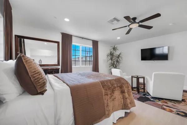 a bedroom with a bed and dresser