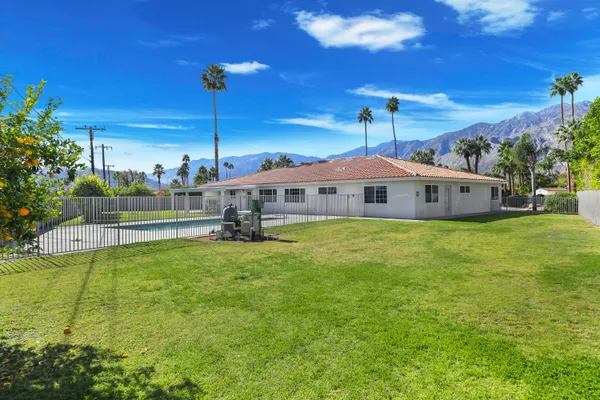 a view of a backyard of a house with a mountain