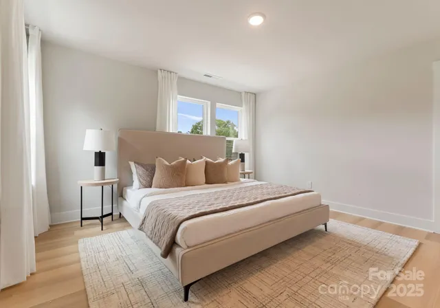 a bed room with a bed and a window