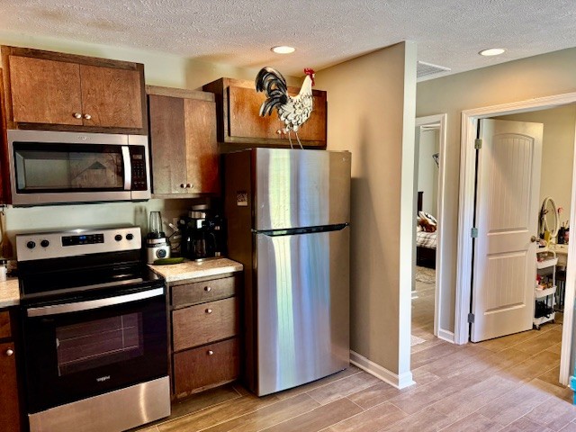 1316 Old Cowan Road Winchester, TN 37398 - Photo 16 of 23 a kitchen with stainless steel appliances and refrigerator