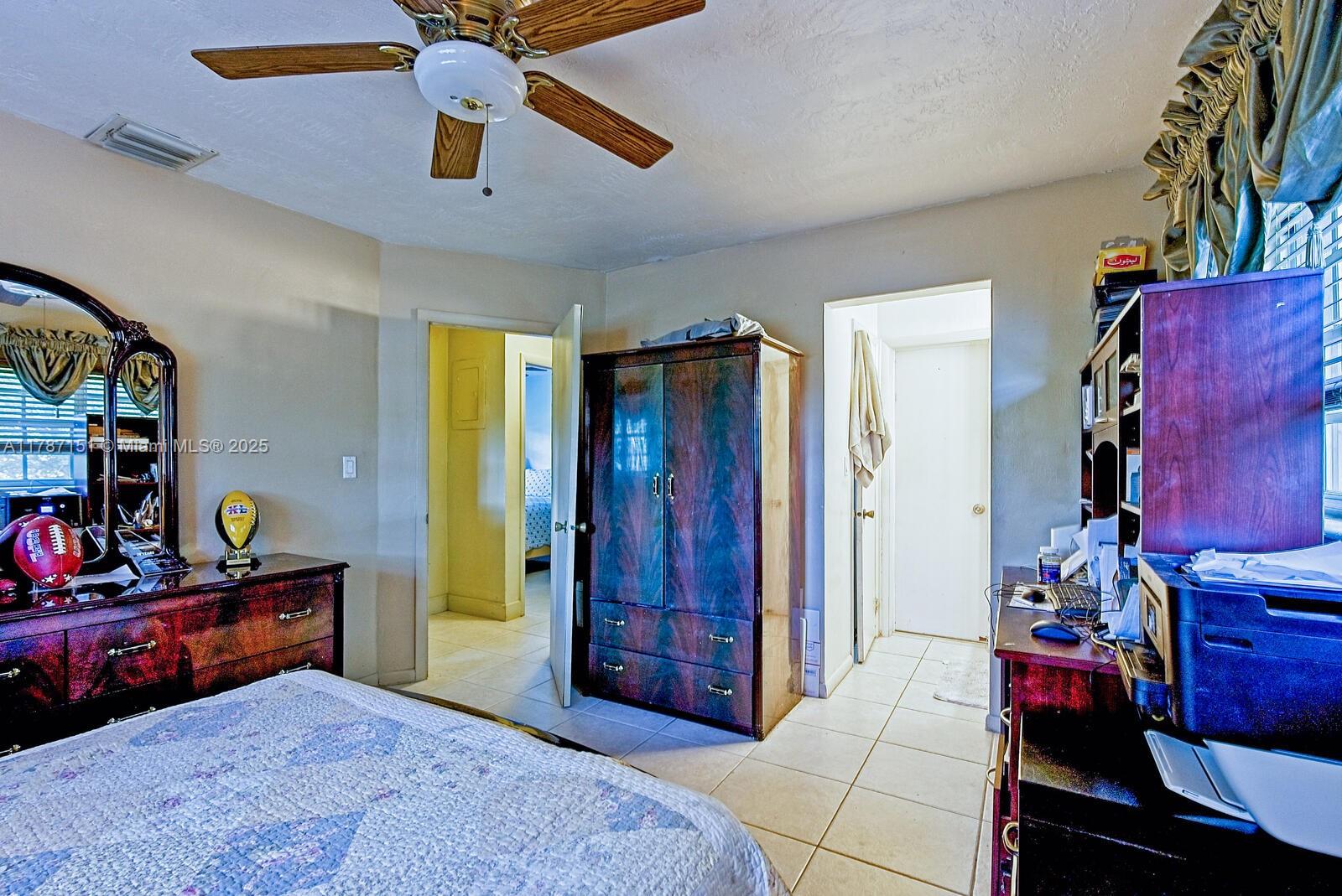 Kendall Miami, FL 33176 - Photo 14 of 26 a bedroom with furniture and a chandelier