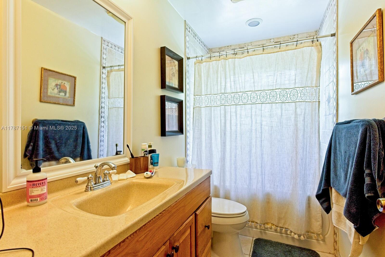 Kendall Miami, FL 33176 - Photo 18 of 26 a bathroom with a sink toilet and shower