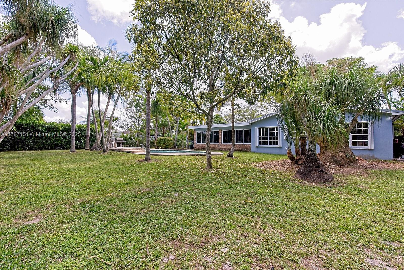 Kendall Miami, FL 33176 - Photo 23 of 26 a house with trees in the background