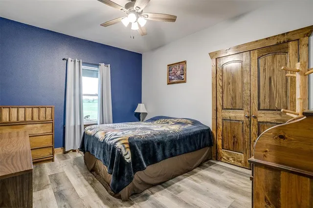 a bedroom with a bed and a desk