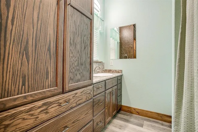a bathroom with a sink and a mirror