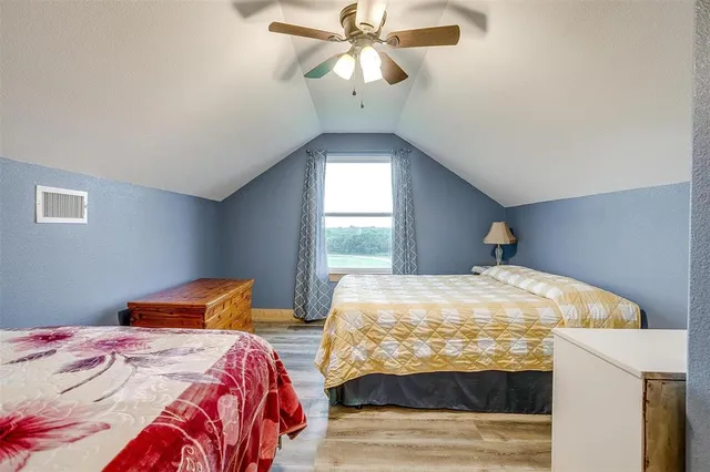 a view of a house with swimming pool and a yard