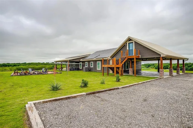 a view of a house with a big yard