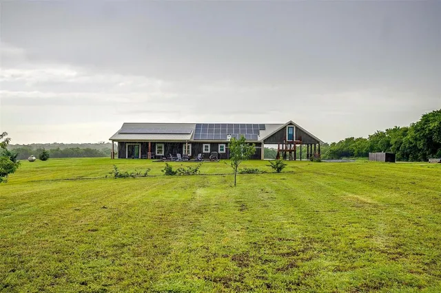 a view of a house with a big yard