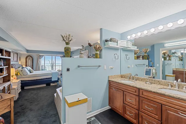 a bathroom with a sink double vanity and a shower