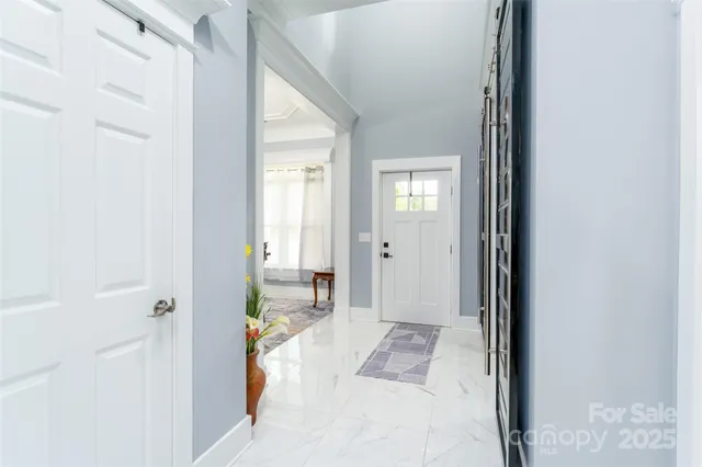 a bathroom with a toilet sink vanity and mirror