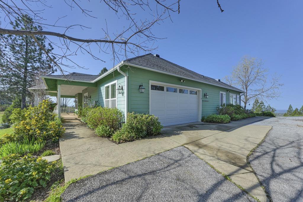 5901 Traverse Creek Road Garden Valley, CA 95633 - Photo 11 of 98 a front view of a house with garden