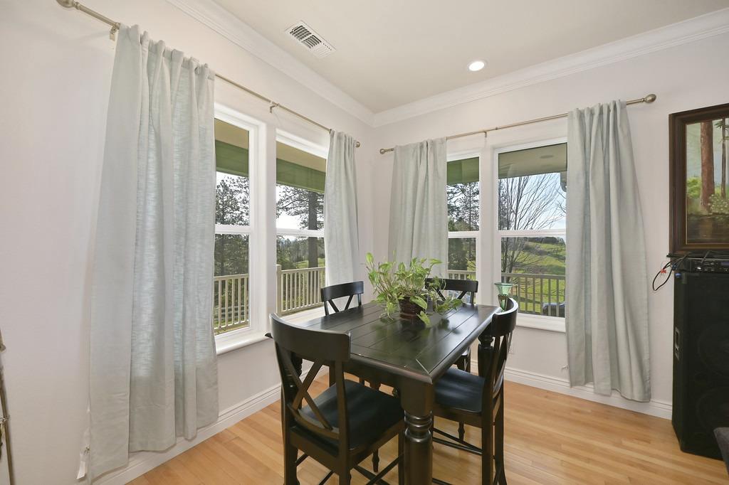 5901 Traverse Creek Road Garden Valley, CA 95633 - Photo 26 of 98 a view of a dining room with furniture and wooden floor