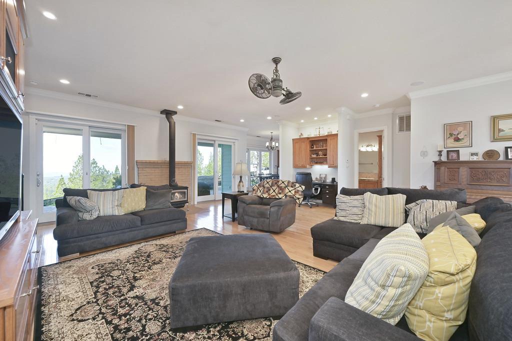 5901 Traverse Creek Road Garden Valley, CA 95633 - Photo 28 of 98 a living room with furniture kitchen view and large windows