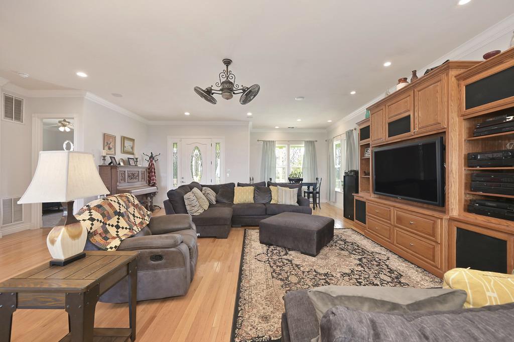 5901 Traverse Creek Road Garden Valley, CA 95633 - Photo 31 of 98 a living room with furniture and a flat screen tv