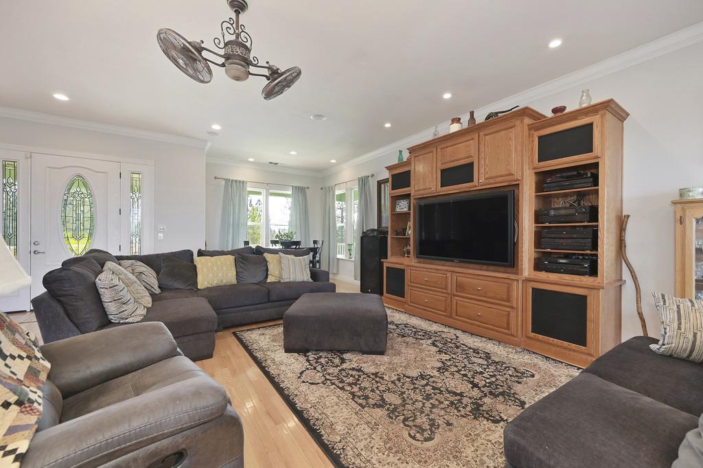 5901 Traverse Creek Road Garden Valley, CA 95633 - Photo 32 of 98 living room featuring ornamental molding, light wood-type flooring, and recessed lighting