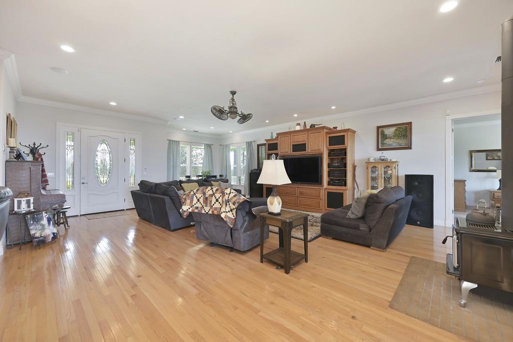 5901 Traverse Creek Road Garden Valley, CA 95633 - Photo 33 of 98 a living room with furniture large window and flat screen tv